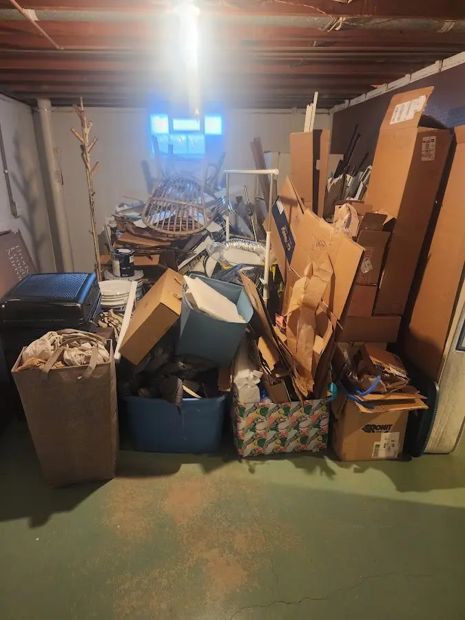 Roll-off dumpster container at job site for 2 Yard Dumpster Rental in Gaylord